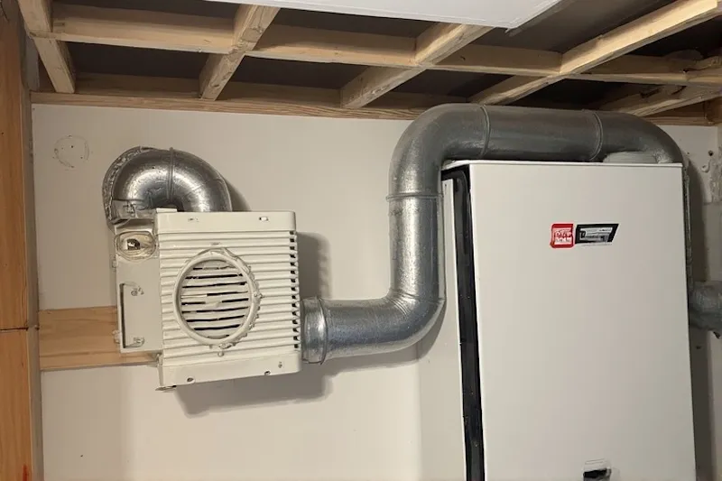 Compact ERV unit installed in a residential utility closet, perfect for home ventilation